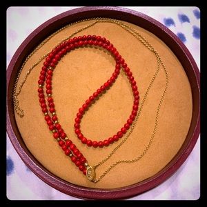Long red beaded necklace
